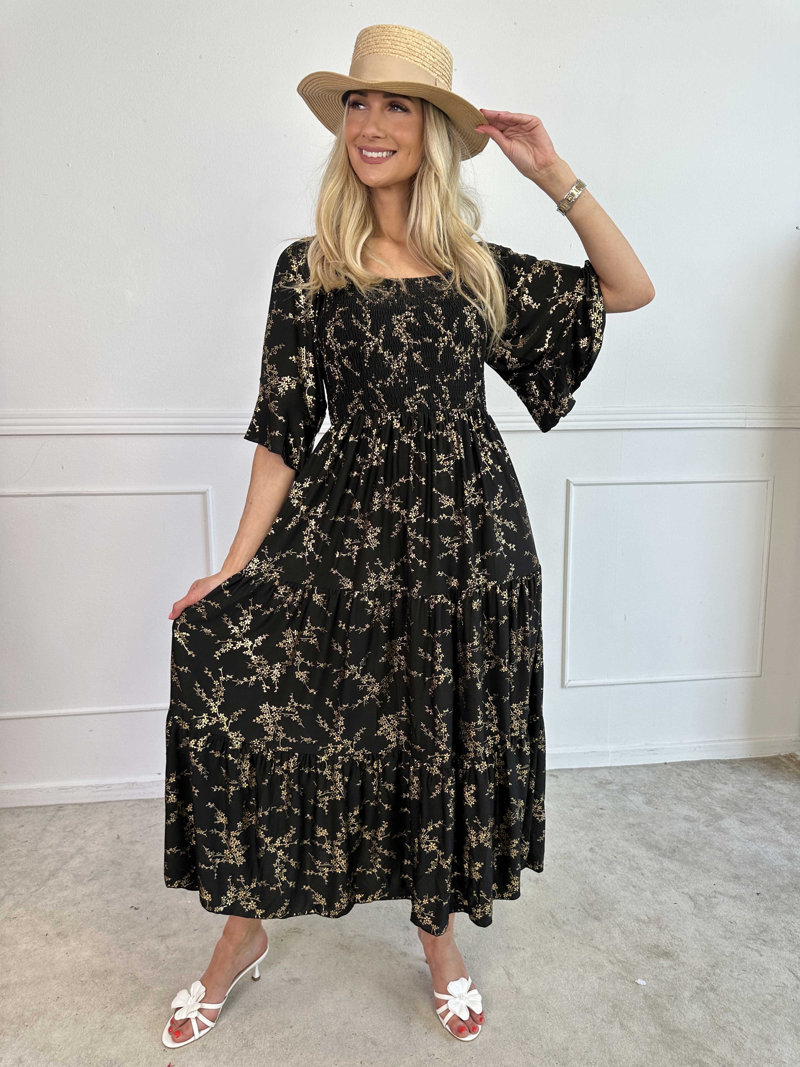 Elna Gold - Ensfarvet elastisk kjole med smock og guld print